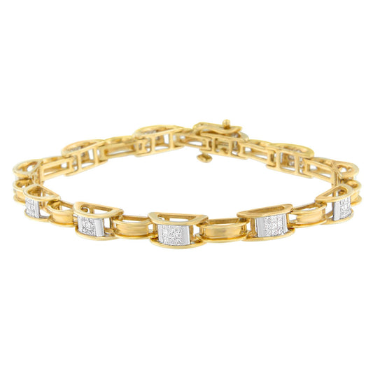 Yellow metal bracelet with alternating curved links and sections set with white princess-shaped gemstones in a channel setting, shown in a front angled view.