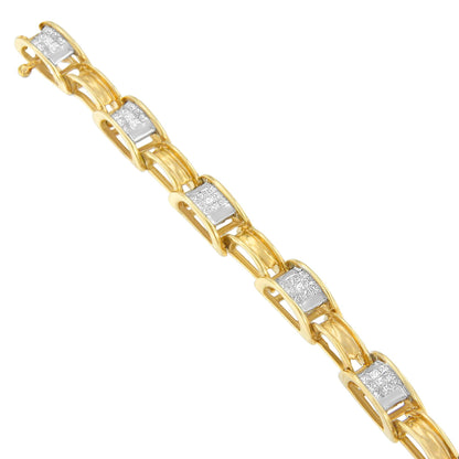 Angled close-up of a yellow metal bracelet with linked segments featuring channel-set white princess-shaped gemstones.
