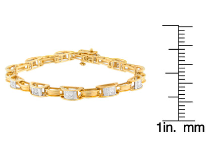Yellow metal bracelet with sections of channel-set white princess-shaped gemstones, displayed flat at an angle, next to a ruler for size reference.