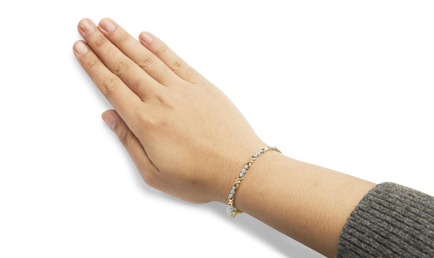 Yellow bracelet with round white gemstones in miracle setting worn on model's wrist, side angle.