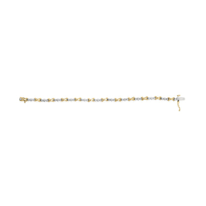 Bracelet with alternating yellow and white metal X-shaped links and round white gemstones set between them, shown from a top-down angle.