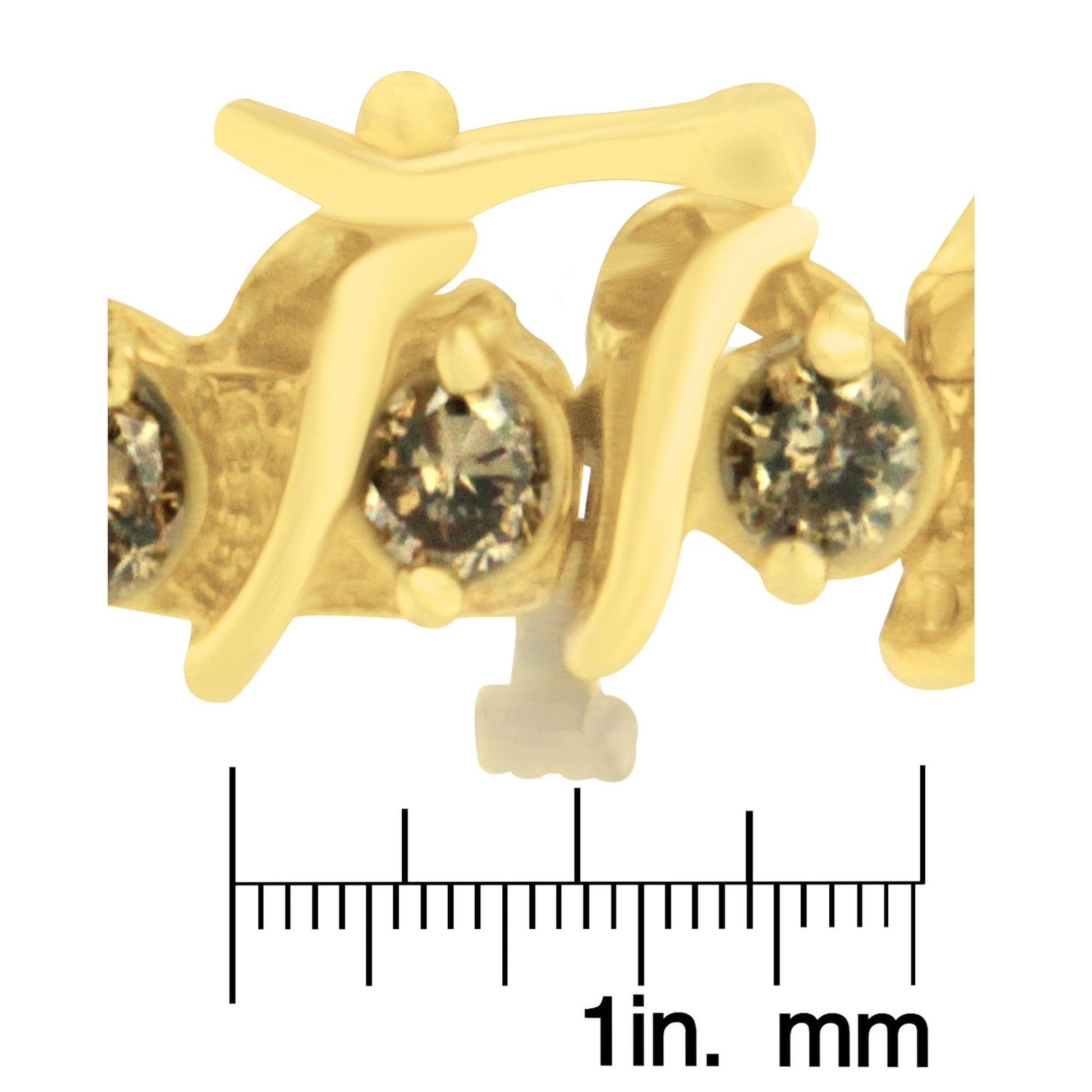 Close-up image of a yellow bracelet with brown round gemstones in prong settings, shown on a ruler for size reference.