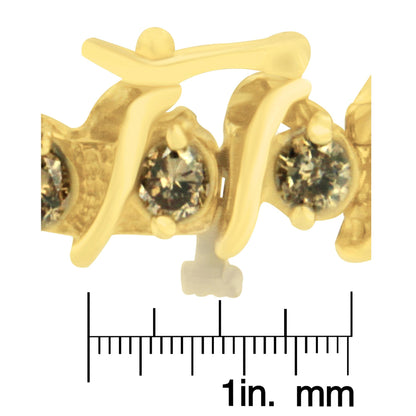 Close-up image of a yellow bracelet with brown round gemstones in prong settings, shown on a ruler for size reference.