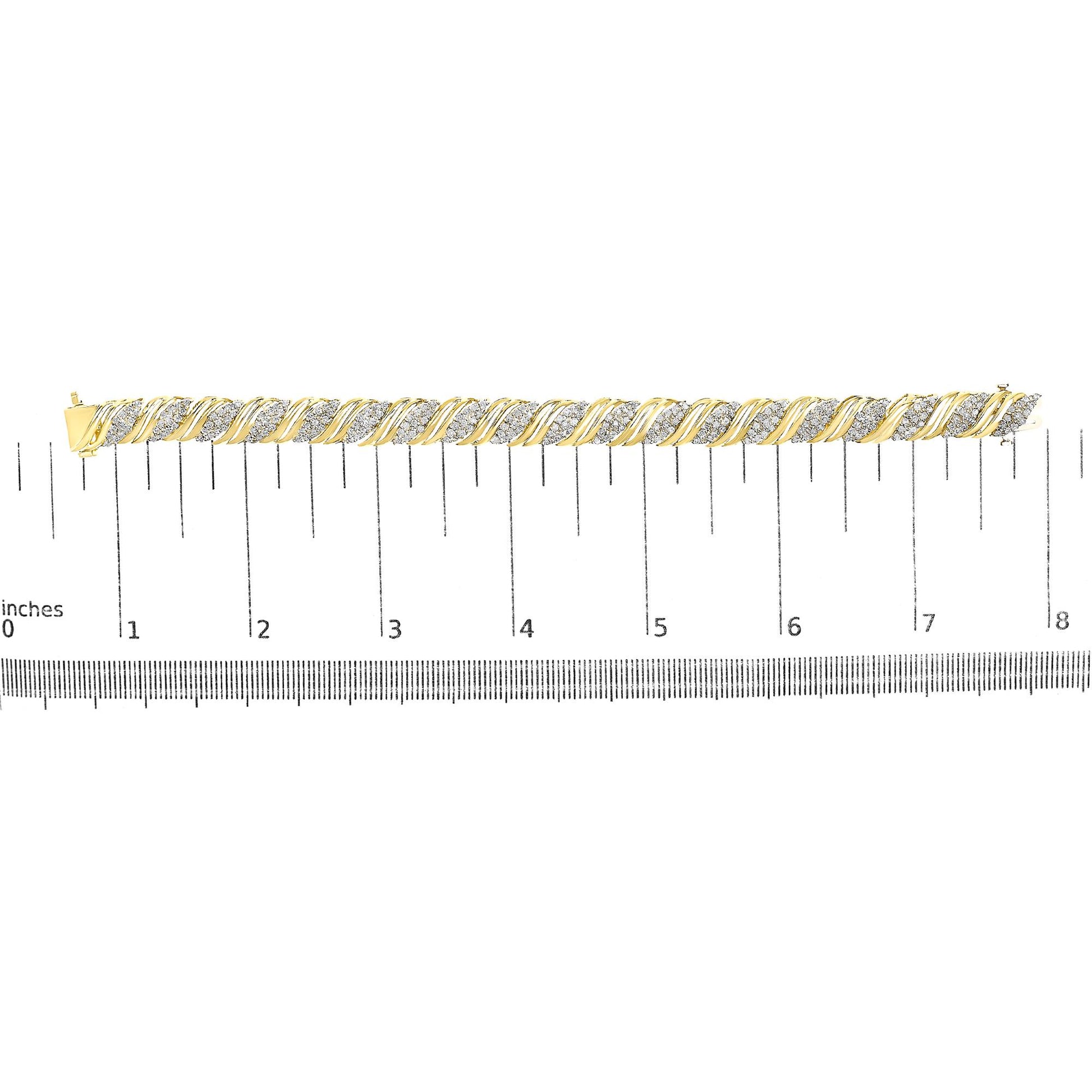 Yellow bracelet with alternating twisted metal and clusters of white gemstones in a prong setting, shown on a measuring scale from a top-down angle.