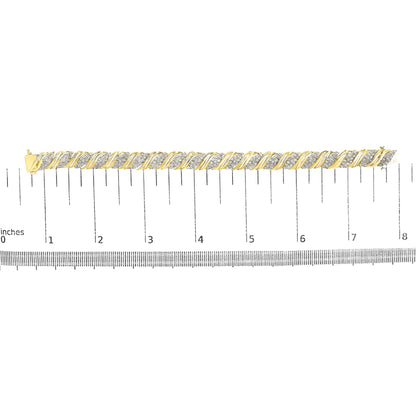 Yellow bracelet with alternating twisted metal and clusters of white gemstones in a prong setting, shown on a measuring scale from a top-down angle.