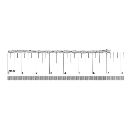 White bracelet with round prong-set white gemstones and channel-set princess-shaped white gemstones, displayed flat on a ruler for size reference, photographed from above.