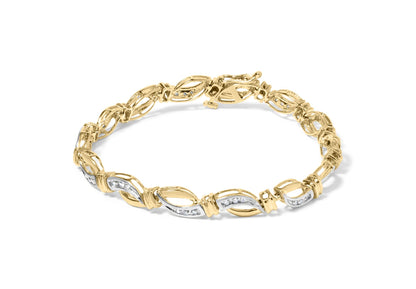Bracelet with alternating yellow and white metal links set with round white gemstones in a channel setting, shown from a top front angle on a white background.