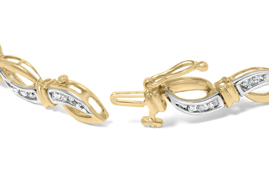 Close-up front angle of a yellow and white metal bracelet segment with oval-shaped links featuring channel-set white round gemstones, showing the clasp mechanism.