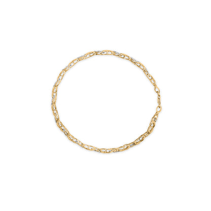 Yellow metal bracelet with linked design featuring round white gemstones in pave setting, displayed flat from a top-down angle.