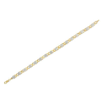Yellow metal bracelet with round white gemstones in pave setting, shown flat from an angled top view.