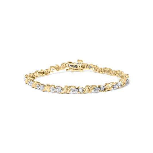 Yellow metal bracelet with round white gemstones in miracle setting, shown from front angle.