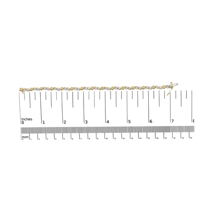 Yellow metal bracelet with alternating twisted links and round white gemstones in miracle setting, laid flat on a ruler for size reference, top-down angle.