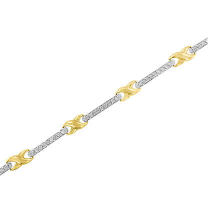 Diagonal close-up of a yellow metal bracelet featuring alternating links of yellow metal design and bars set with round white gemstones in prong settings.
