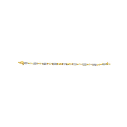 Yellow metal bracelet with alternating sections of round white gemstones set in prongs and twisted metal links, shown in a top-down view.