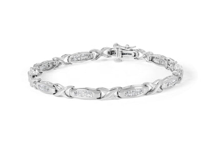 White metal bracelet with alternating links and rectangular settings holding multiple white gemstones, shown from an angled top view on a white background.