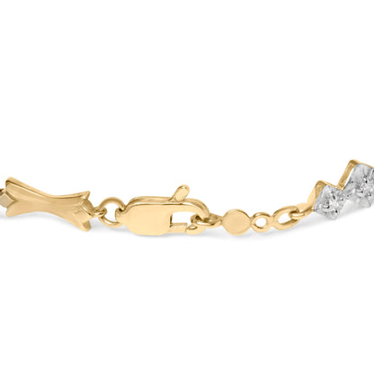 Close-up side angle of a yellow and white metal bracelet clasp featuring round white gemstones in a miracle setting.