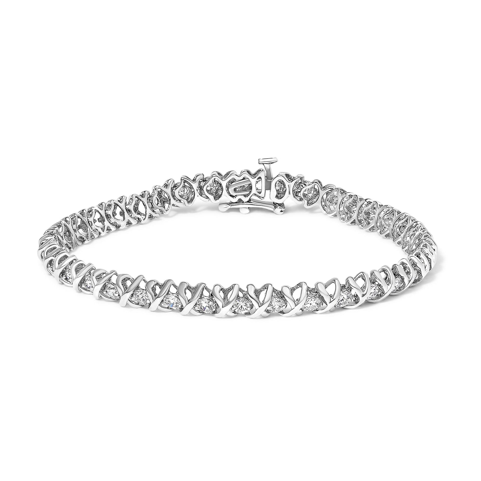 White metal bracelet with round white gemstones in 2-prong settings, displayed in a front-facing angle, showing the clasp.