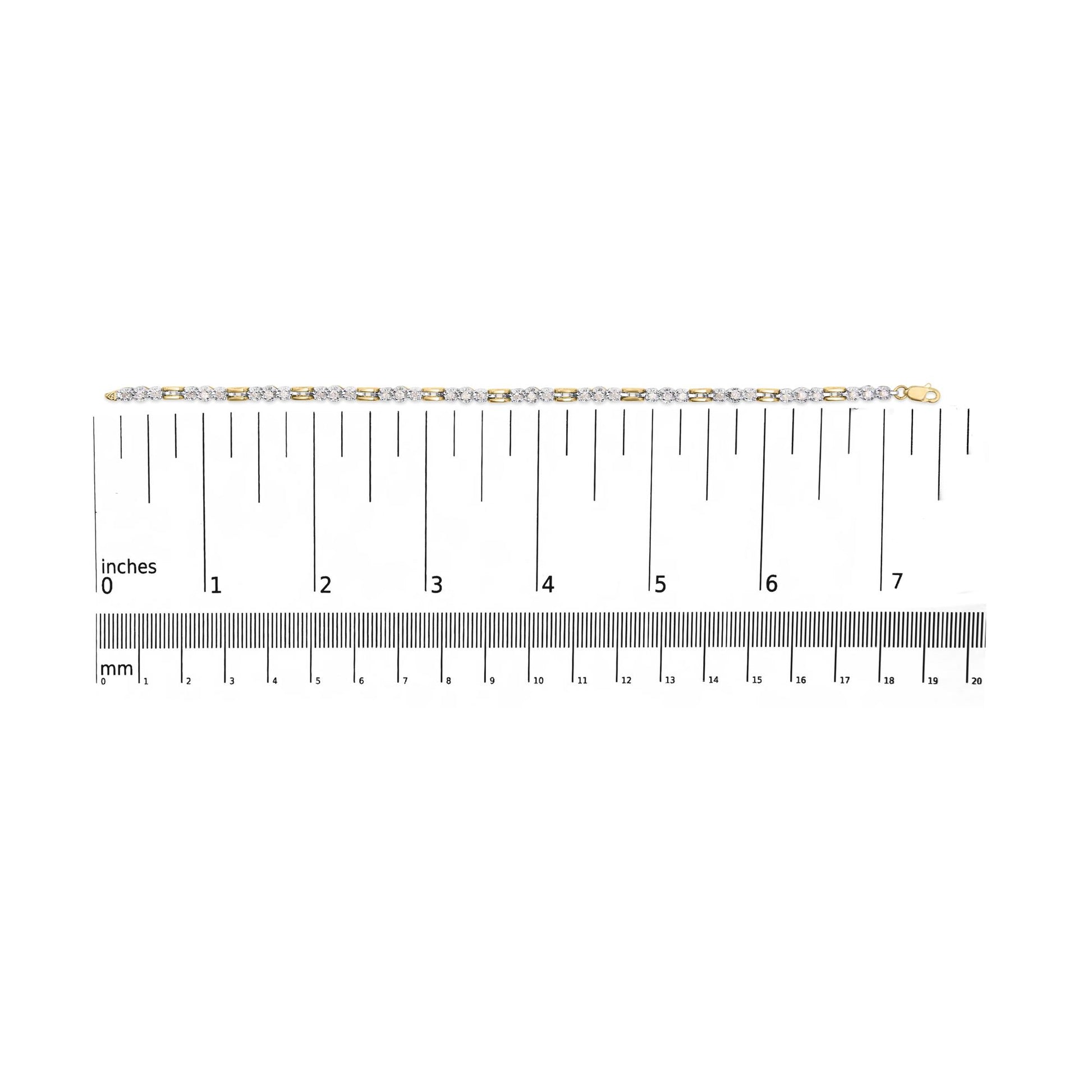 Bracelet with alternating yellow and white metal links featuring white round gemstones in prong settings, displayed flat on a ruler for size reference, shot from above.