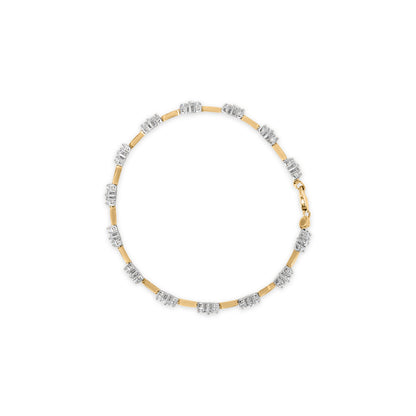 Top-down view of a yellow metal bracelet featuring alternating segments with clusters of small white round gemstones in prong settings.