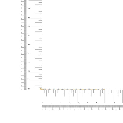 Yellow metal bracelet with round white gemstones in prong settings, displayed flat on a ruler for size reference, overhead angle.