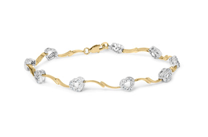 Bracelet with alternating yellow and white metal links featuring round white gemstones in prong settings, shown at a slight top angle on a white background.