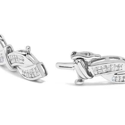 Close-up angled view of a white metal bracelet featuring intertwined links with rows of princess shape white gemstones in an invisible setting.