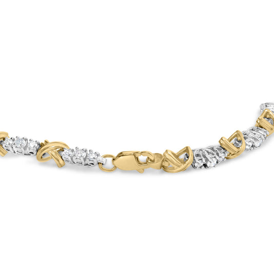 Close-up front angle of a bracelet with alternating yellow and white metal links, set with round white gemstones in prong settings, shown on a white background.