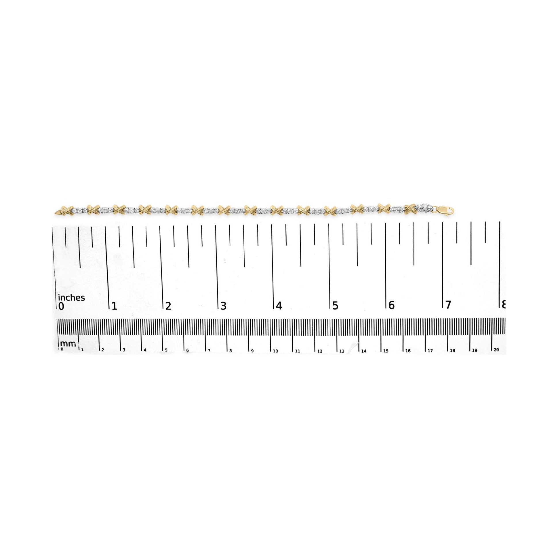 Bracelet shown on a scale, viewed from top, featuring alternating yellow and white metal links with round white gemstones set in prong settings.