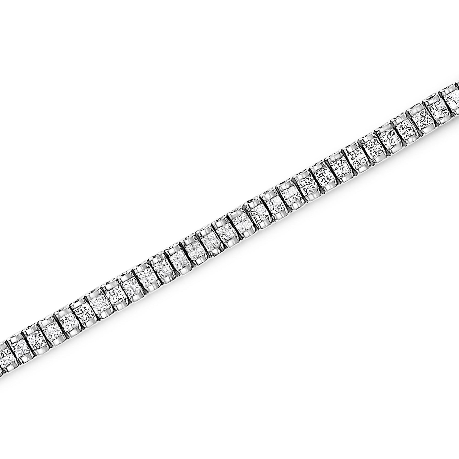 Diagonal close-up of a white bracelet with square white gemstones in invisible setting.