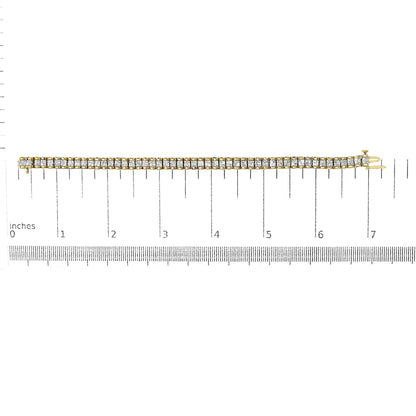 Yellow metal bracelet with rows of white princess-shaped gemstones in invisible setting, shown flat on a scale, top-down view.