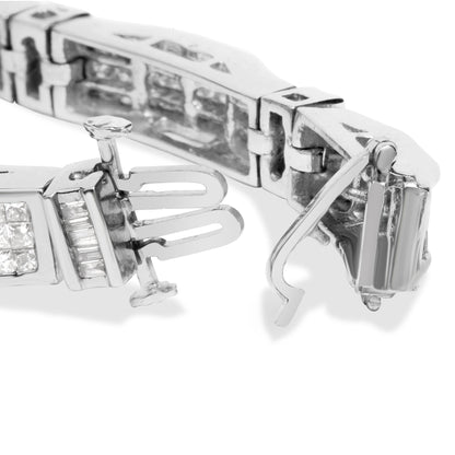 Close-up front angle of white metal bracelet clasp showing baguette and princess shaped white gemstones in channel and invisible settings.
