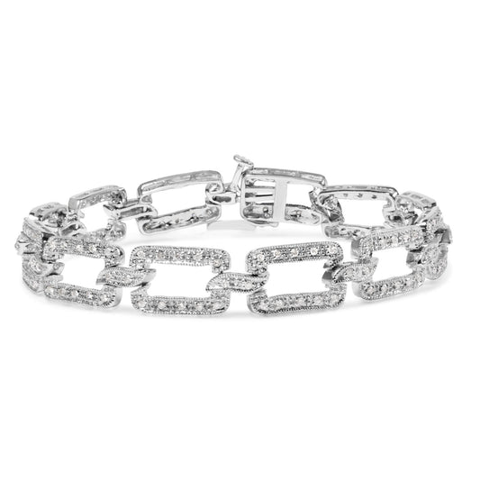 White metal bracelet with open rectangular links featuring round white gemstones in pave setting, shown from front angle.