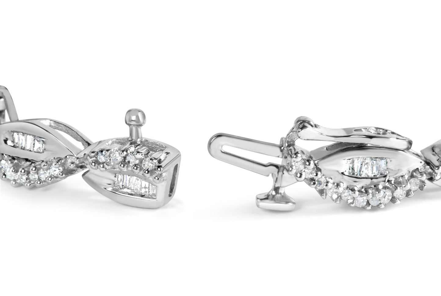 Close-up angled view of a white bracelet featuring round gemstones in prong settings and baguette gemstones in channel settings along a twisted design.