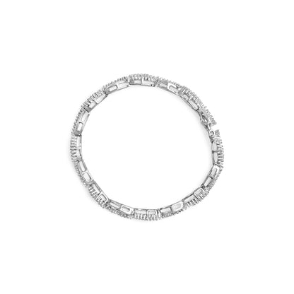 Top-down view of a white metal bracelet featuring round prong-set white gemstones alternating with baguette channel-set white gemstones.