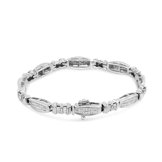 White metal bracelet with princess and baguette shaped white gemstones, shown from an angled top view.