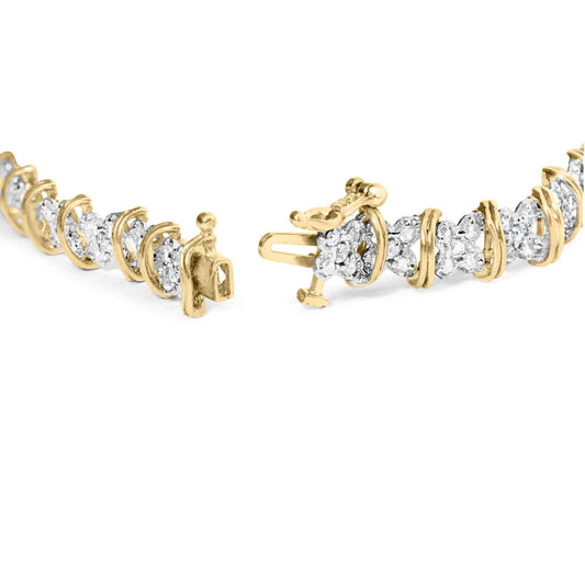 Close-up front angle of a yellow metal bracelet with round white gemstones in a pave setting.