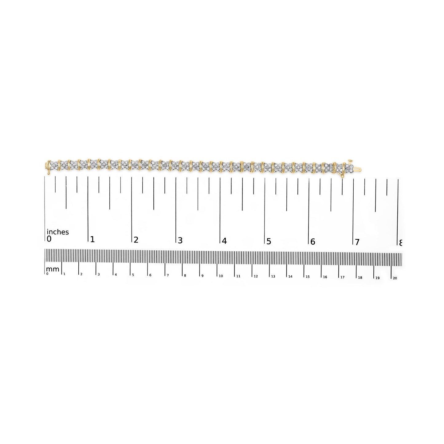 Yellow metal bracelet with round white gemstones in pave setting, shown flat on a ruler for size reference, top-down angle.