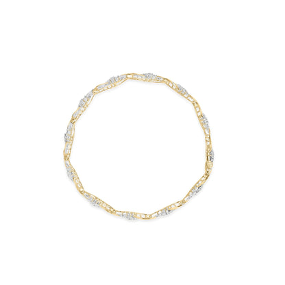 Top-down view of a yellow metal bracelet featuring alternating sections of round prong-set white gemstones and baguette channel-set white gemstones.