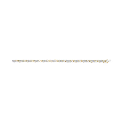 Yellow bracelet shown in a flat lay front angle, featuring alternating sections with round white gemstones in prong settings and sections with baguette white gemstones in channel settings.