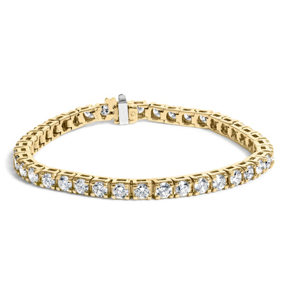 Close-up front angle of a yellow bracelet set with round white gemstones in prong settings, displayed on a white background.