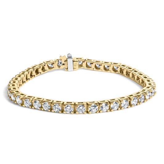 Close-up front angle of a yellow bracelet set with round white gemstones in prong settings, displayed on a white background.