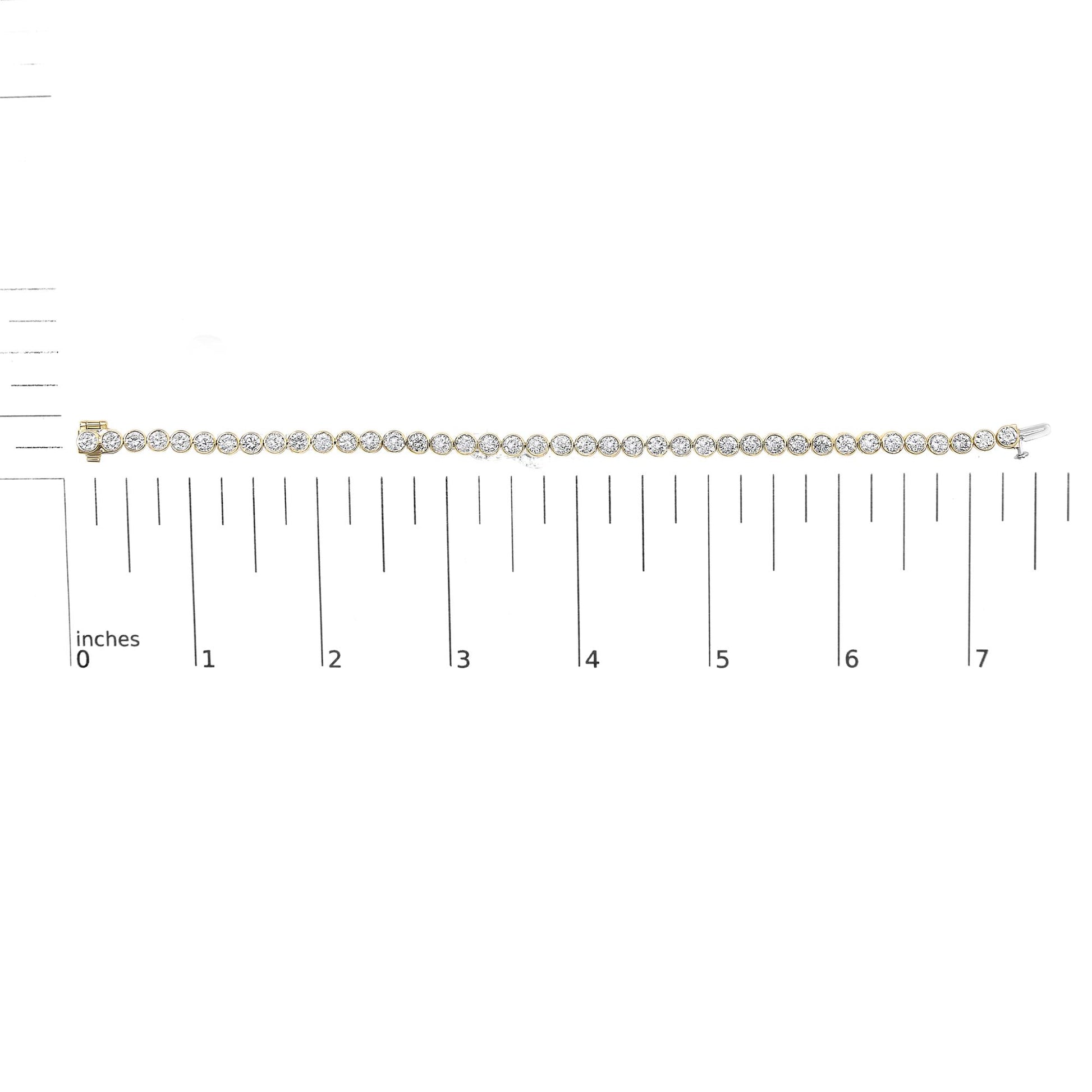Yellow bracelet with round white gemstones in bezel settings, shown on a scale, front view.