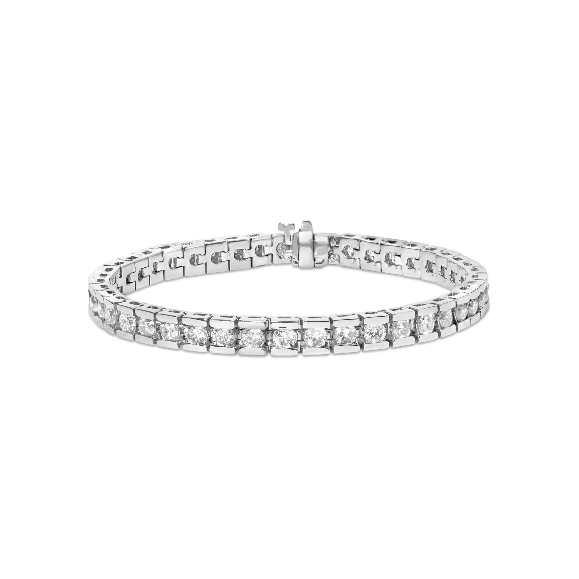 White metal bracelet with round white gemstones in channel setting, shown from a front angle.