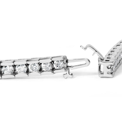 Close-up side angle of a white metal bracelet with round white gemstones in a channel setting, showing the open clasp mechanism.