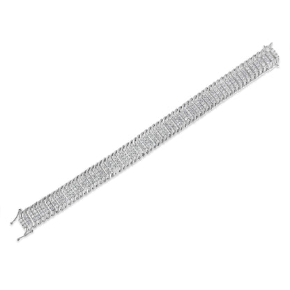 White metal bracelet with multiple rows of round white gemstones in prong settings, shown flat at an angle.
