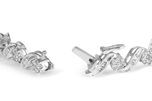 Close-up of a white metal bracelet featuring round white gemstones in prong settings and baguette white gemstones in channel settings, shown at an angle on a white background.