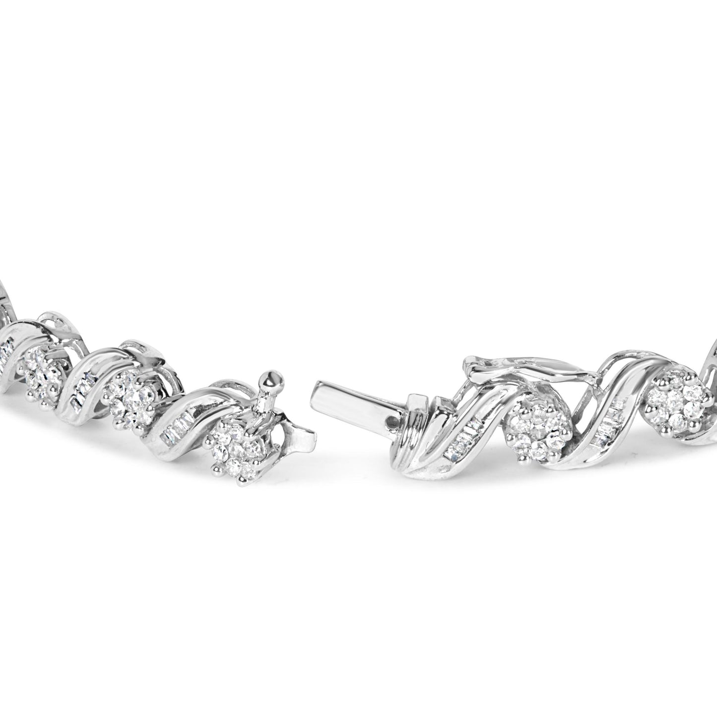 Close-up image of a white metal bracelet with an alternating design of round white gemstones in prong settings and baguette white gemstones in channel settings, shown at a slightly angled side view.