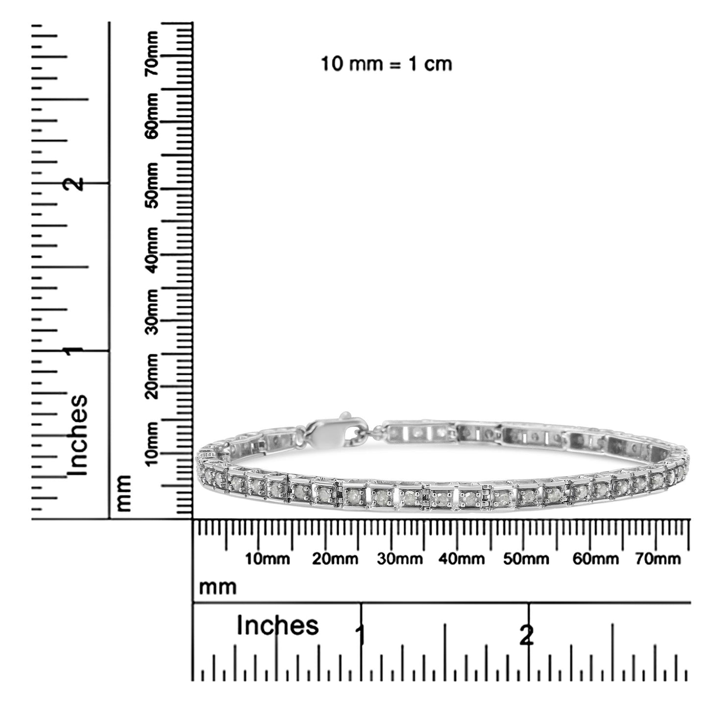 White metal bracelet with round white gemstones in prong settings, displayed flat on a ruler for size reference, shot from a front angle.