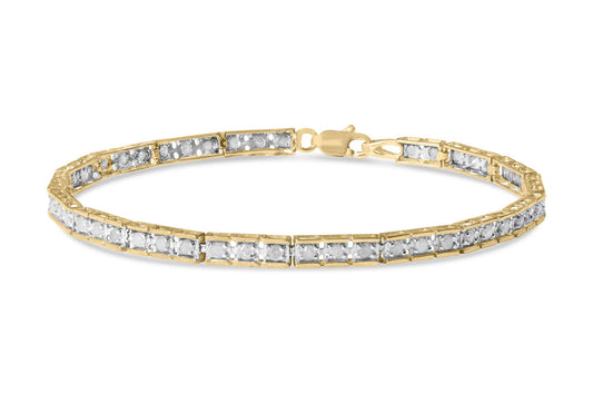 Yellow metal bracelet with round white gemstones in pave setting, shown in a front angled view.