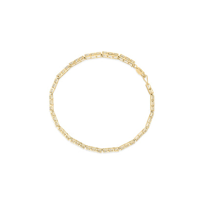 Top-down view of a yellow bracelet with rectangular links each set with small white gemstones in a pave setting.